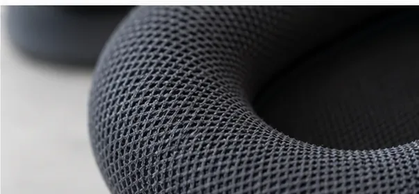 Close-up of the dark woven fabric on an AirPods Max ear cushion before cleaning