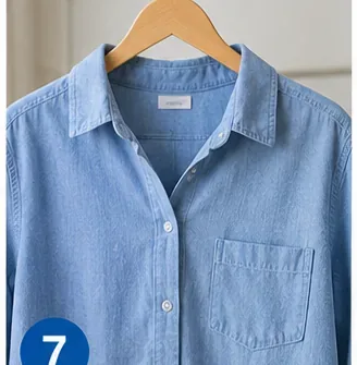 Light blue shirt hanging to air-dry before the stained area is checked