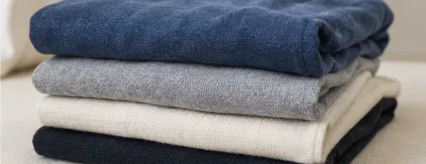 Neatly folded clean clothes after sticker residue treatment