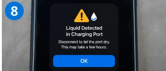 A smartphone screen showing a persistent liquid-detected warning in the charging port.