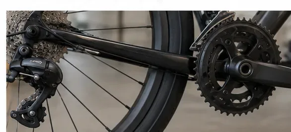 Bicycle drivetrain with chain removed from the chainrings, cassette, and rear derailleur