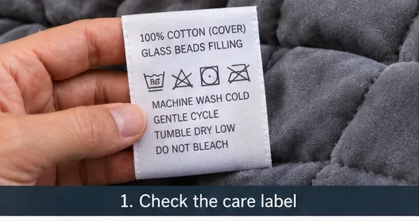 Close-up of a gray weighted blanket care label listing glass-bead filling and washing symbols.