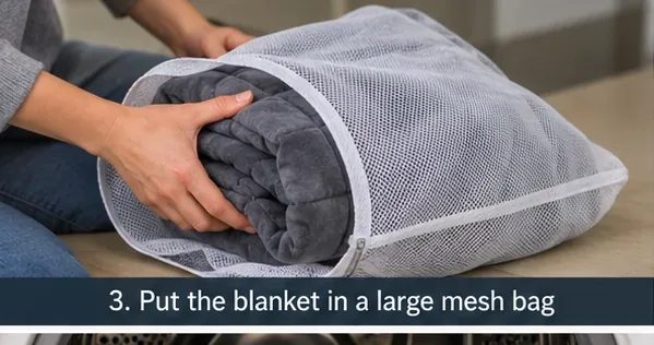 Gray weighted blanket being placed inside a large white mesh laundry bag.