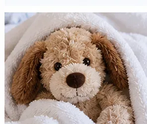 Freshly washed stuffed dog wrapped gently in a clean towel to remove excess moisture