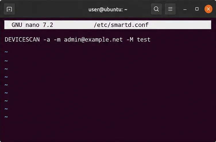 メール受信者とテスト指示を含むsmartd.confのDEVICESCAN行を表示するナノエディタ