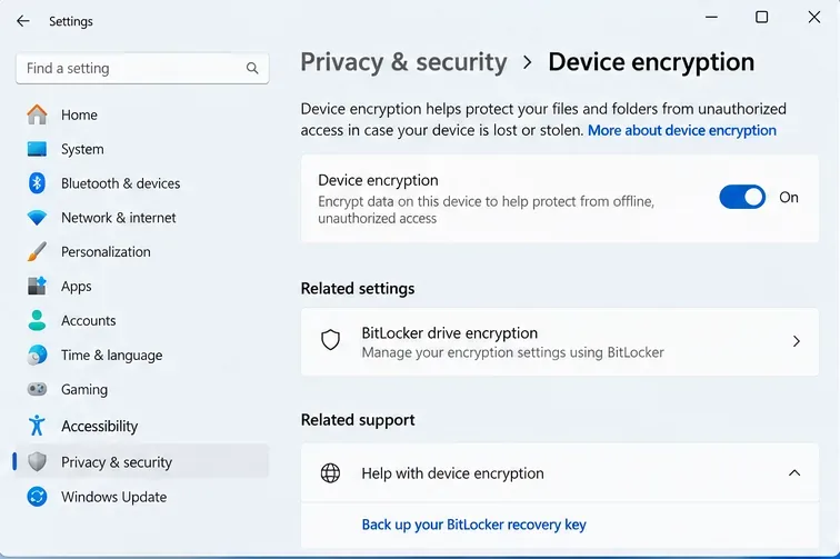 Windows 11 Device encryption settings with the encryption toggle on and a BitLocker recovery-key link