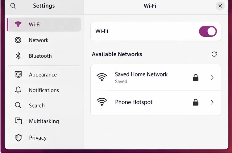 Ubuntu Settings Wi-Fi page lists a saved home network and a separate phone hotspot as available networks.