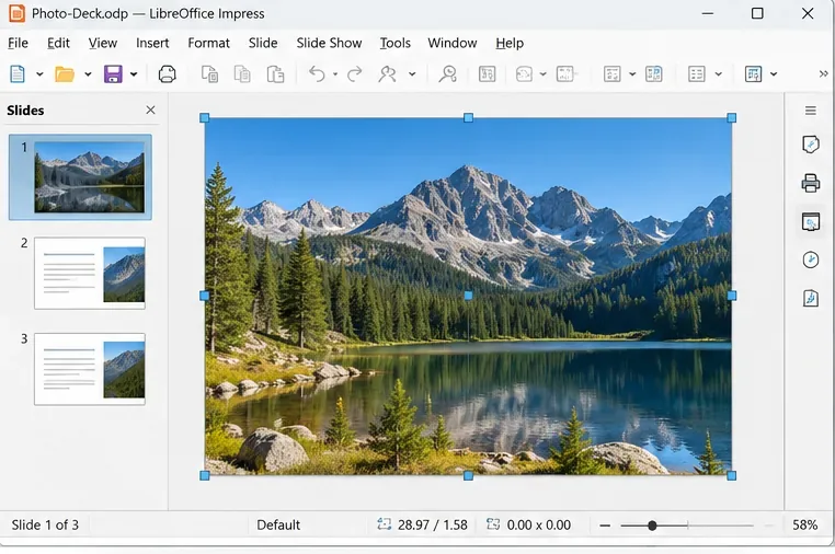 LibreOffice Impress showing a mountain-lake photograph selected on the first slide with resize handles.