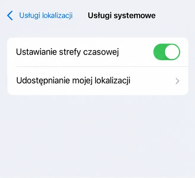 Poglądowy ekran usług systemowych iPhone’a z aktywnym ustawianiem strefy czasowej